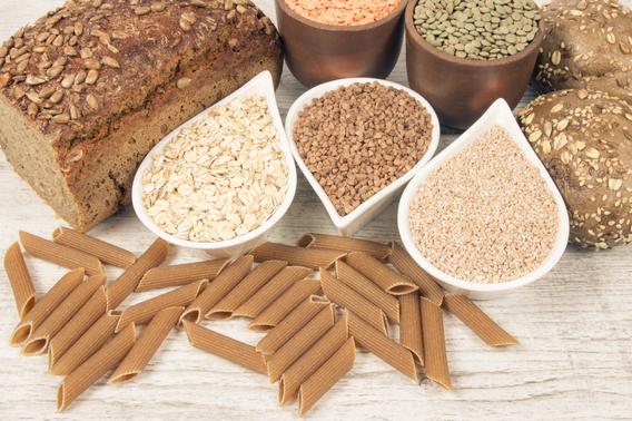 Various whole grain pastas and breads and uncooked grains